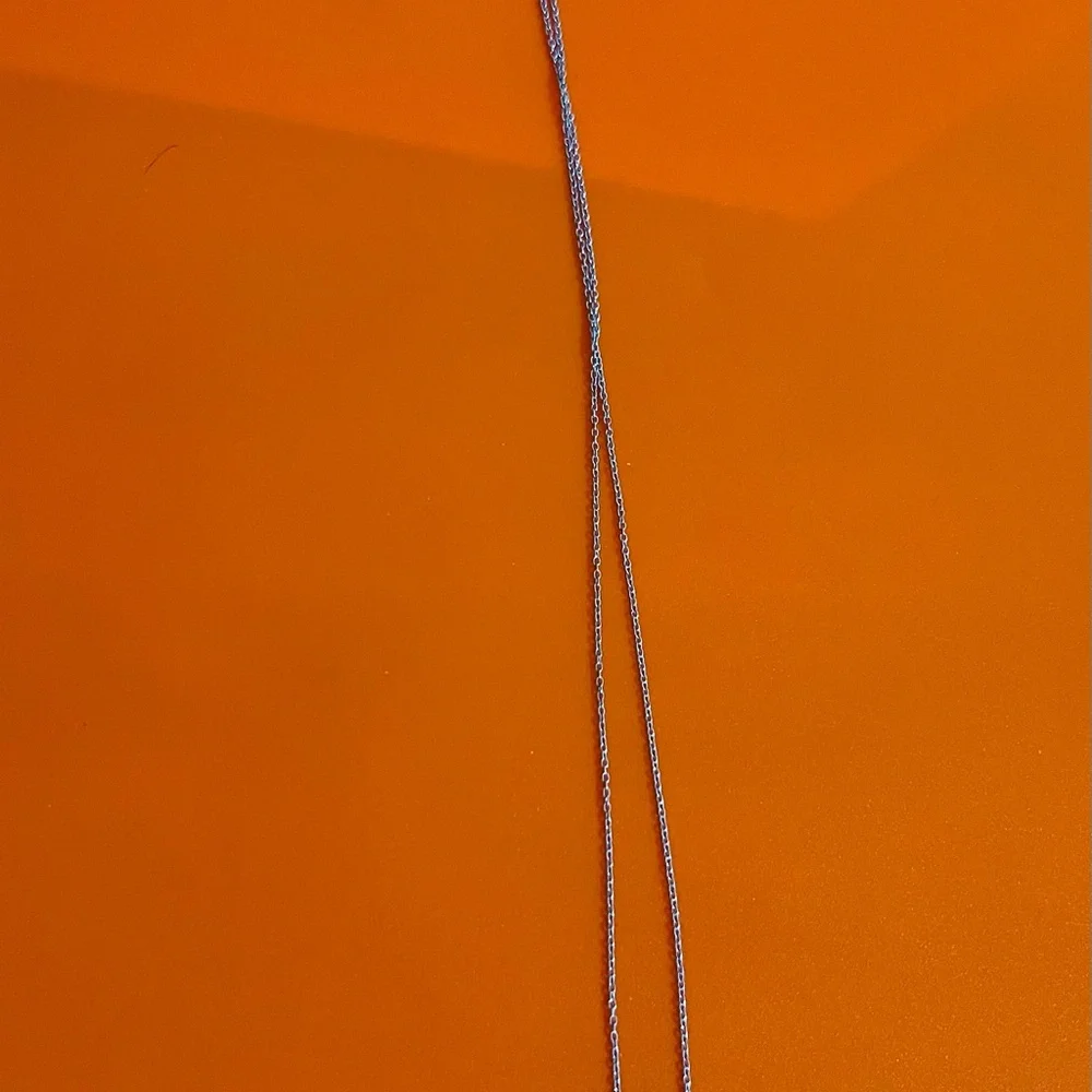 Elegant Silver Necklace with Sunburst Pendant